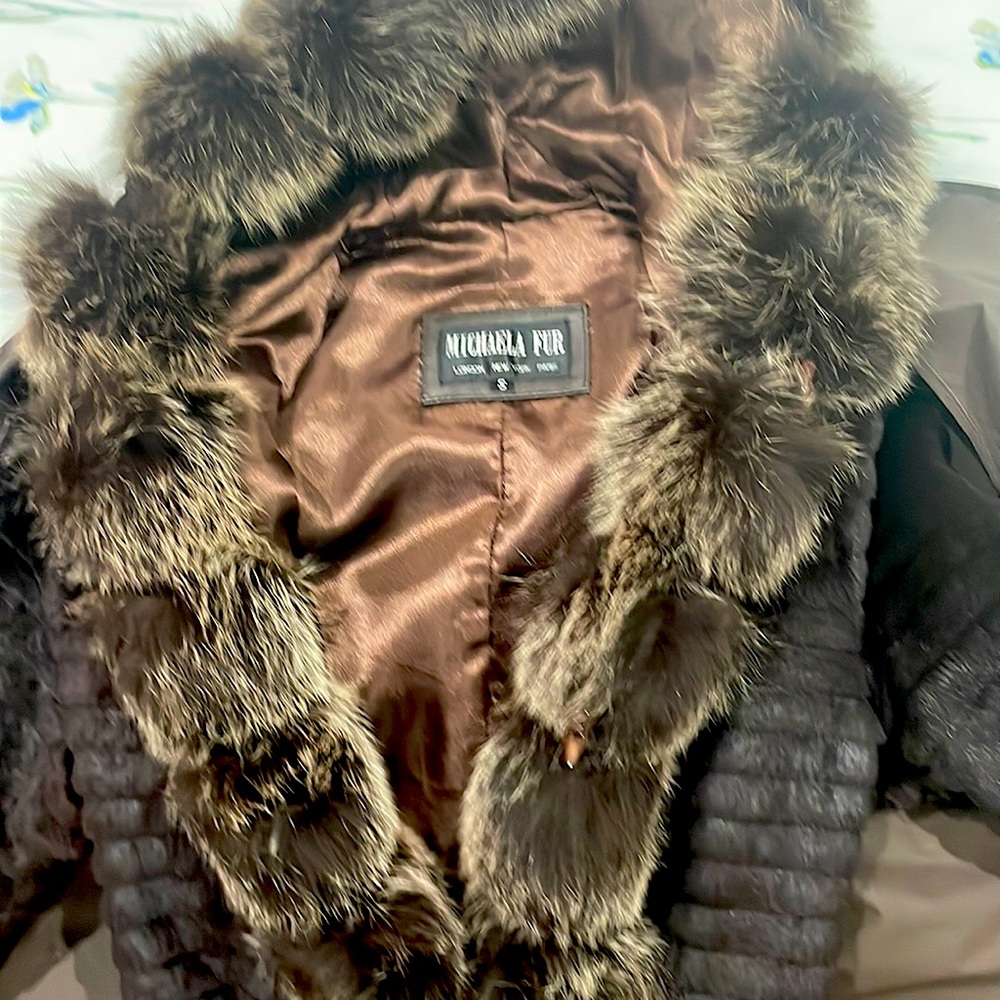 Used fur coat. Almost new. Only worn 4 times. Extremely warm and soft.
